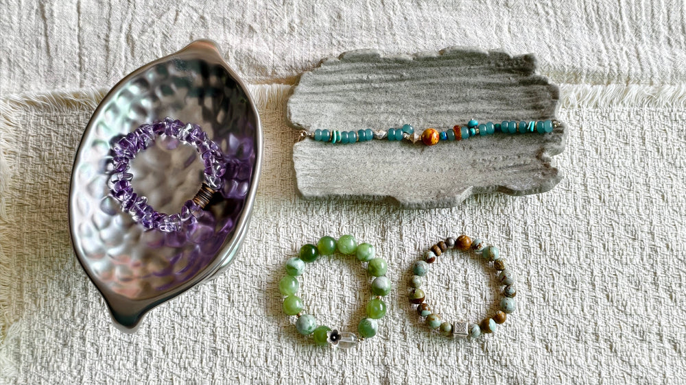 Four handmade gemstone bracelets showing chip beads, round beads and chain construction