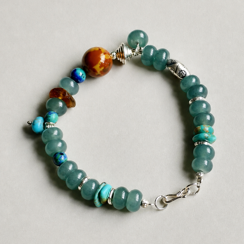 Handmade blue quartz and turquoise bracelet on a neutral background