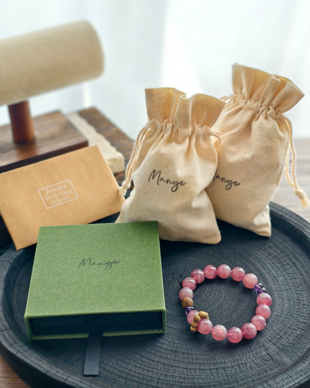 packaging
Handmade pink natural stone bracelet with Manye Rituals jewelry packaging