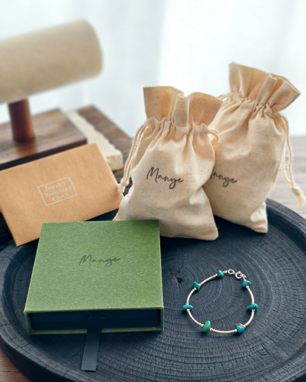 Handmade turquoise tone stone bracelet with Manye Rituals jewelry packaging