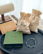 Handmade turquoise tone stone bracelet with Manye Rituals jewelry packaging