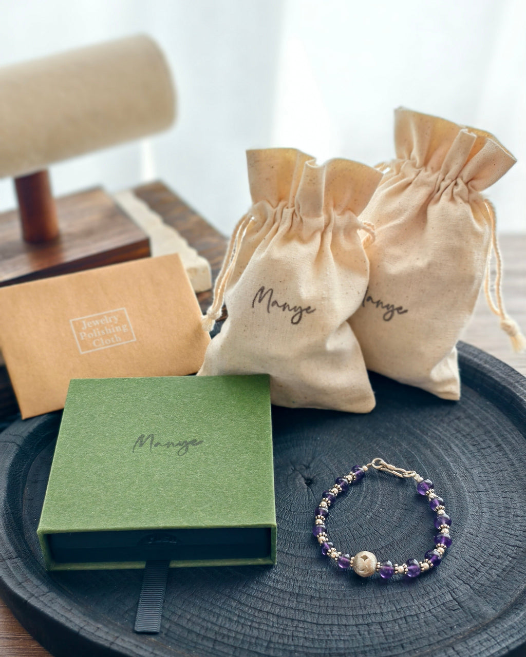 Handmade purple natural stone bracelet with Manye Rituals jewelry packaging