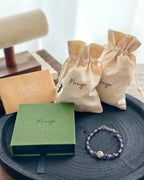 Handmade purple natural stone bracelet with Manye Rituals jewelry packaging