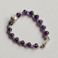 Handmade amethyst crystal bracelet with silver accents