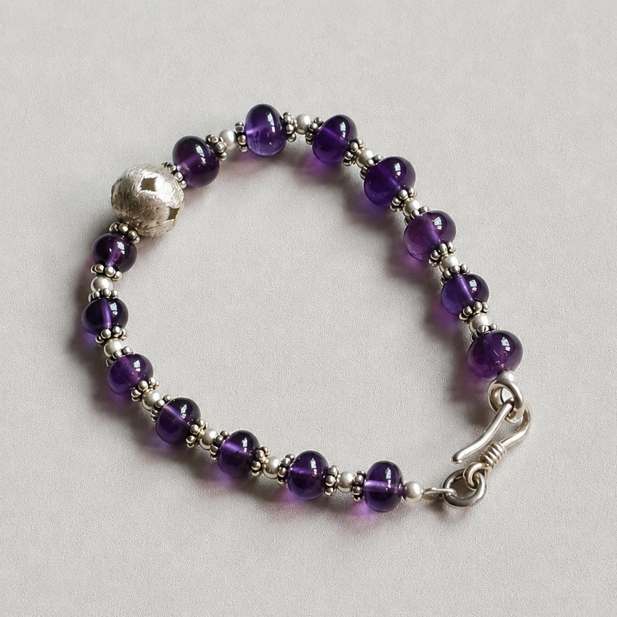 Handmade amethyst crystal bracelet with silver accents