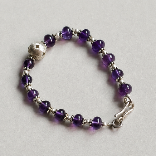 Handmade amethyst crystal bracelet with silver accents
