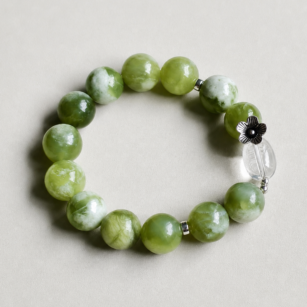 Handmade Xiuyu jade bracelet with clear quartz accent