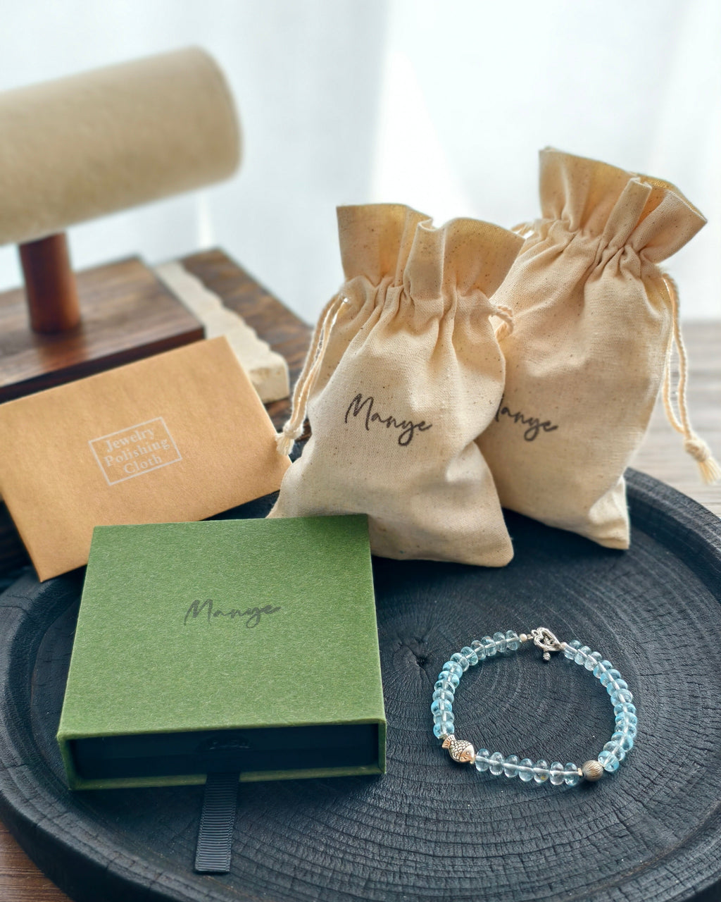 Handmade blue crystal bracelet with Manye Rituals jewelry packaging