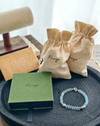 Handmade blue crystal bracelet with Manye Rituals jewelry packaging
