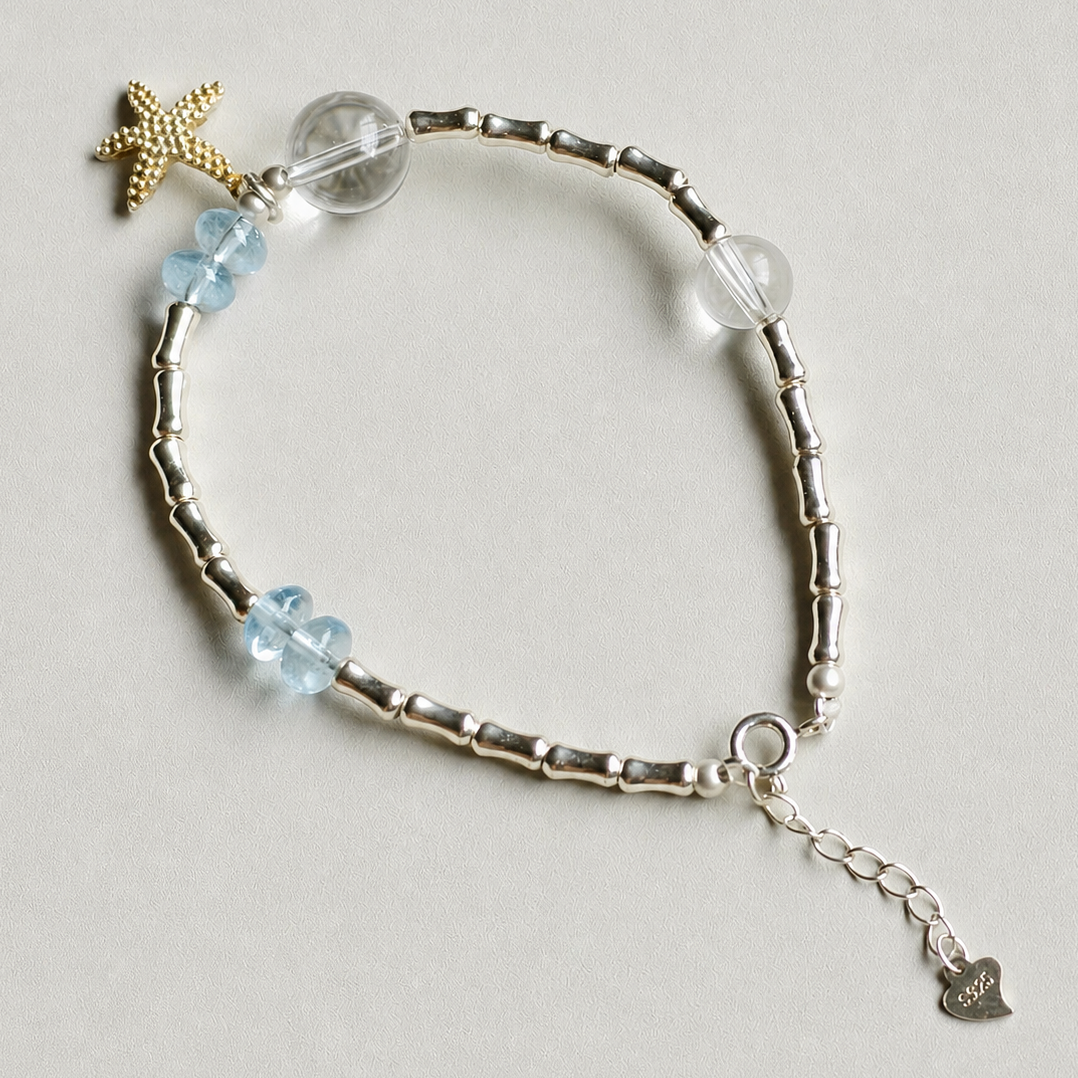 Handmade blue topaz and clear quartz bracelet with starfish charm