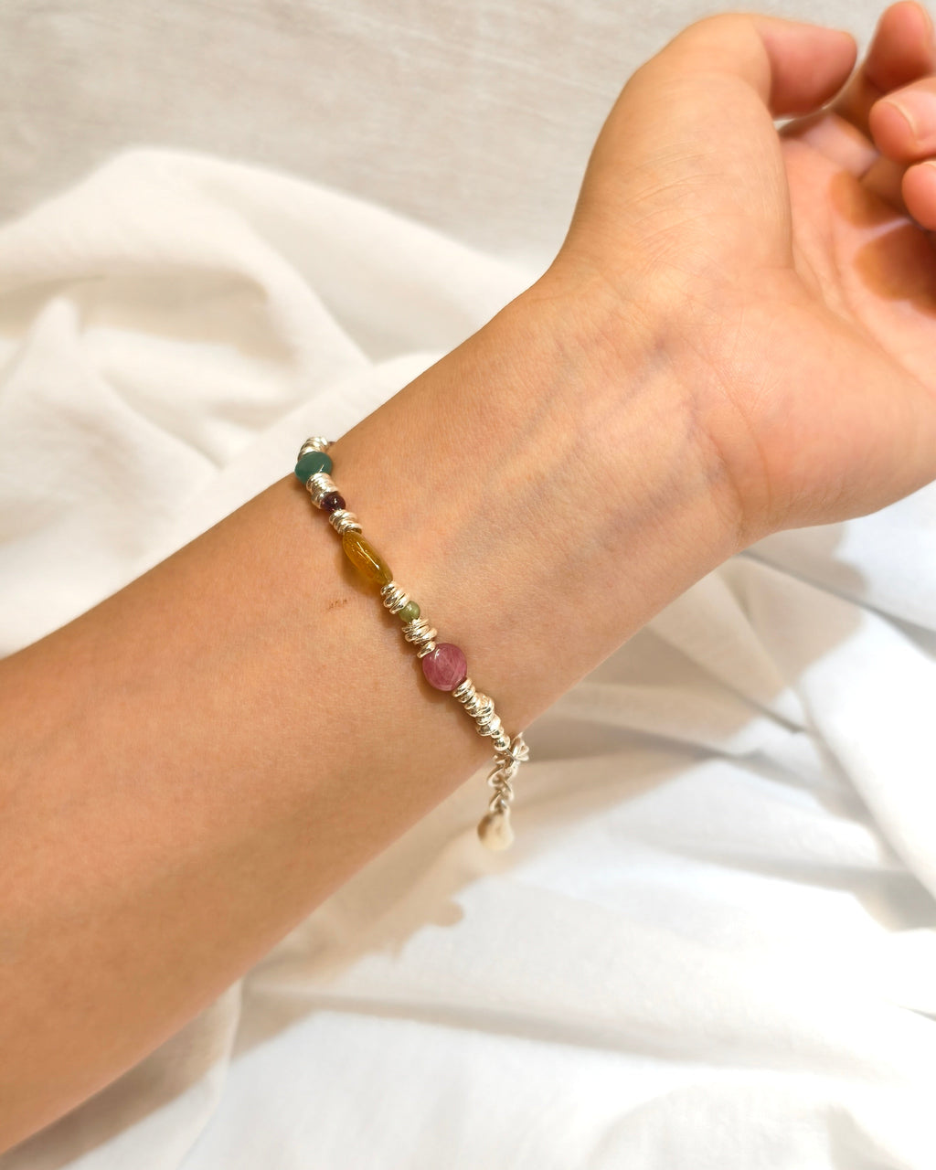 Nature inspired gemstone bracelet with colorful stones worn as handmade jewelry